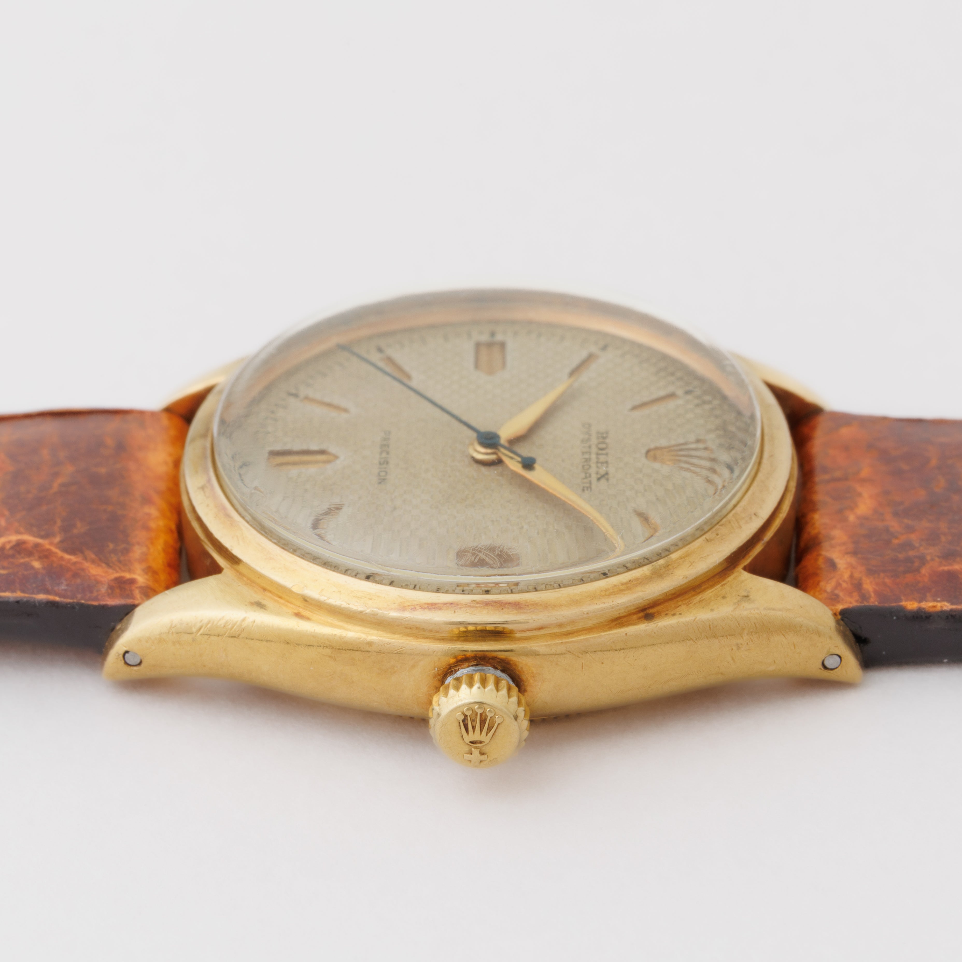 ロレックス 18金無垢オイスターデイトファーストモデル 1951年製 18KYG ワッフル彫り込みダイヤル 赤カレンダー