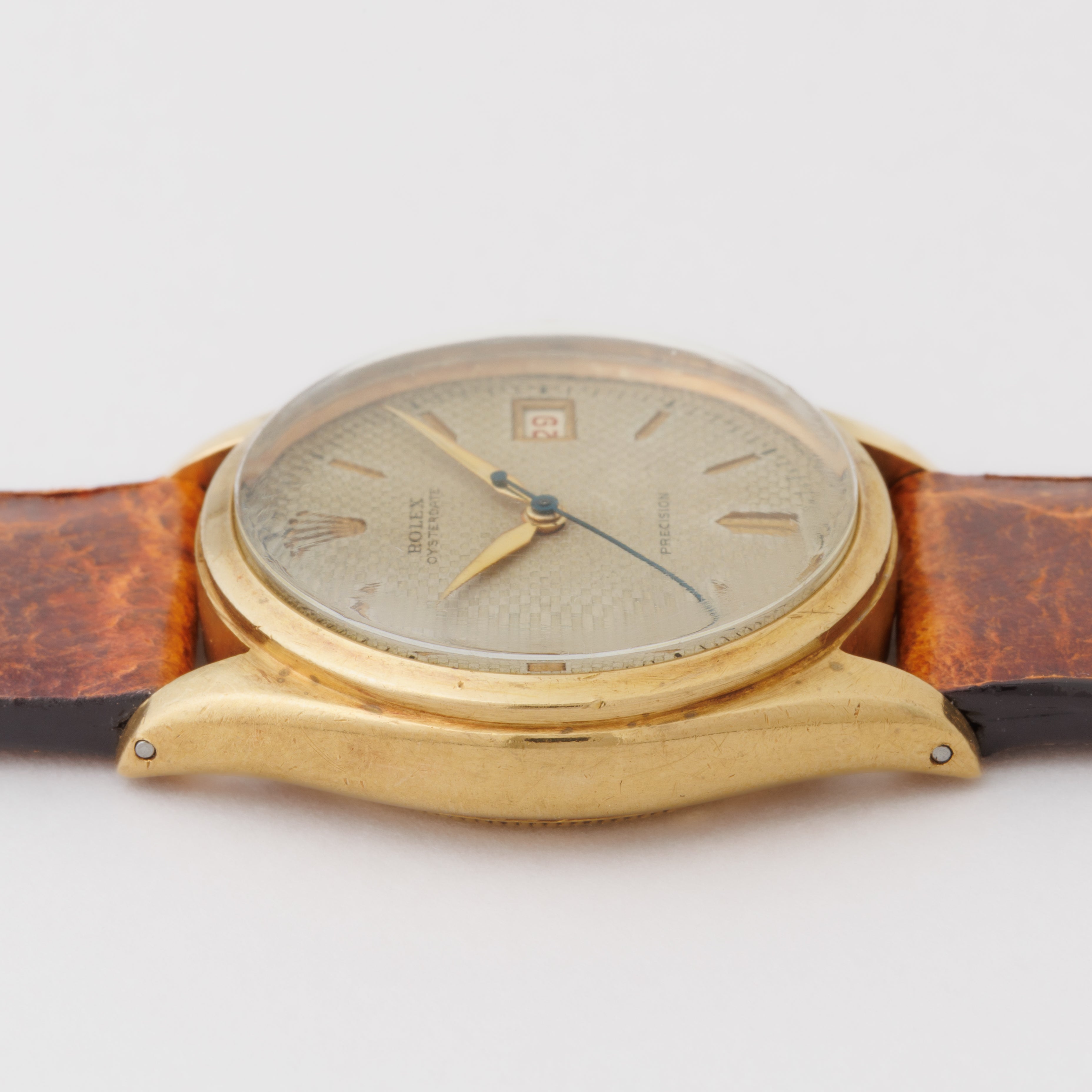 ロレックス 18金無垢オイスターデイトファーストモデル 1951年製 18KYG ワッフル彫り込みダイヤル 赤カレンダー